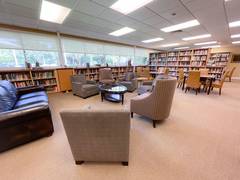 seating area with chairs and sofa in the library